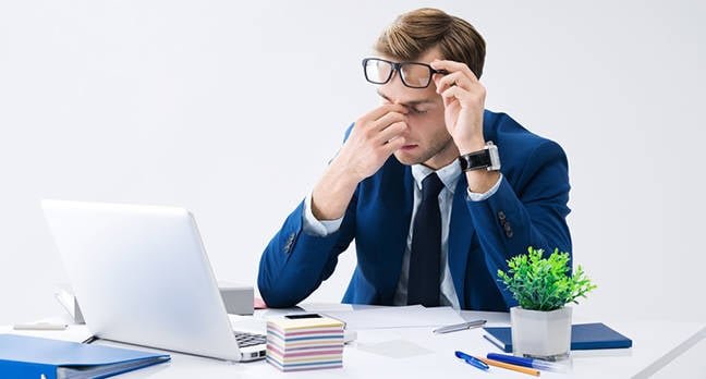 Tired businessman shutterstock.jpg