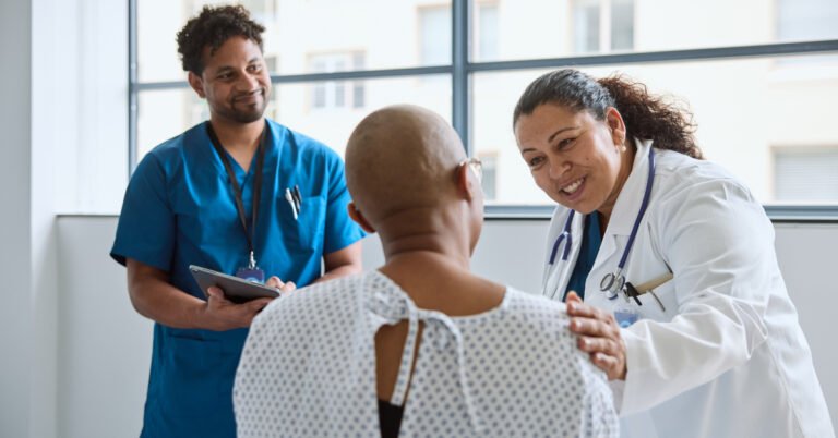 3077696 smiling female doctor encouraging patient in clinic 6ef09fb070.jpeg